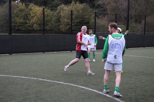 Jonathan Bell MLA checks if his strike is a winner at the recent MLA football match against 'World United' to promote the IFAs Football Against Racism Europe campaign.