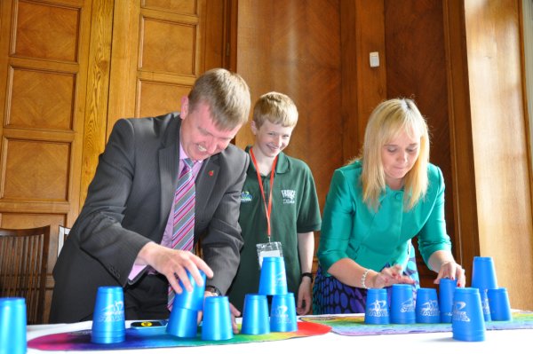 Chairperson of the Education Committee, Mervyn Storey MLA takes on Michelle McIlveen MLA, Chairperson of the Culture, Arts and Leisure Committee in a Sport Stacking race.