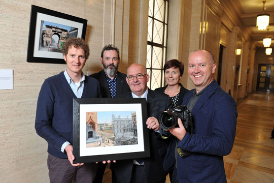 Speaker of the Northern Ireland Assembly, Mr William Hay MLA, attended the launch of ‘The City Revisited – A Rephotographic Study’ at Parliament Buildings. The exhibition is part of the Derry-Londonderry 2013 UK City of Culture’s flagship community engagement project ‘BT Portrait of a City’ and will be on display at Parliament Buildings until 20 September 2013. Pictured (l-r) are Paul McGuckin, photographer; Declan Sheehan, curator Portrait of a City; Speaker of the Northern Ireland Assembly, Mr William Hay MLA; Rachel Heron Sponsorship Manager BT; and Andrew Horsman, photographer.