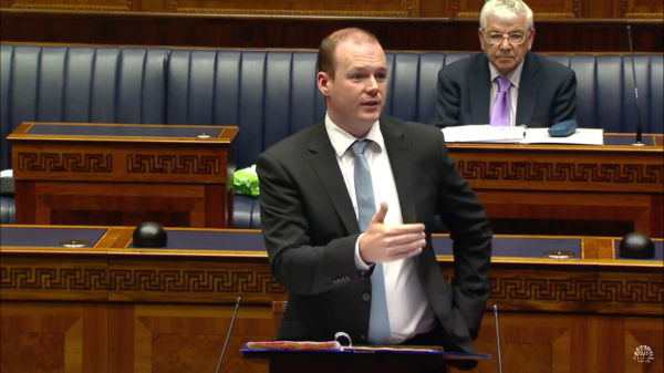 Minister Lyons taking questions from Members on Monday |