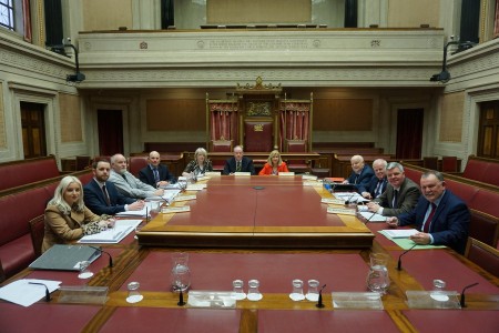The Public Accounts Committee poses for a photo before the start of a meeting.