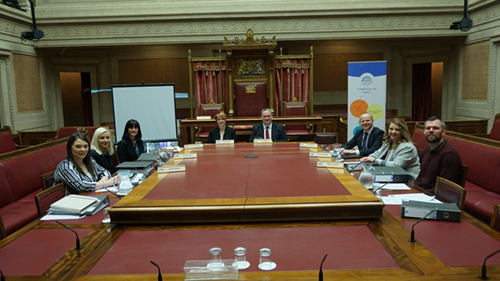 The Health Committee prepare for a meeting in the Senate Chamber