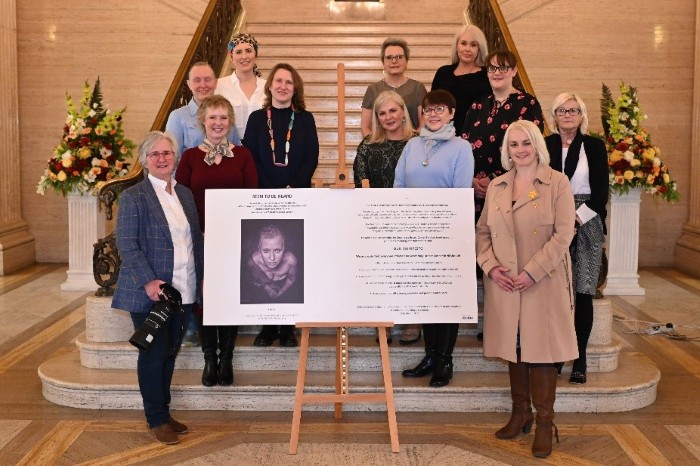 Deputy Chair of the Health Committee with representatives of the Seen to be Heard Exhibition on the steps of the Great Hall in Parliament Buildings