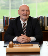 Alex Maskey, Speaker of the Northern Ireland Assembly, sitting at his desk in the Speaker's Office, Parliament Buildings.