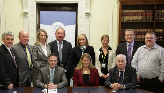 Pictured from L-R standing are: Mr Trevor Buchanan MLA; Mr Kieran McCarthy MLA; Ms Angela Lotta (GCA); Mr William Irwin MLA; Miss Michelle McIlveen MLA; Ms Helen Gordon (GCA); Mr Ian Milne MLA; and Mr Declan McAleer MLA. Seated are: the Committee Chairperson, Mr Paul Frew MLA; the Groceries Code Adjudicator Ms Christine Tacon; and the Committee Deputy Chairperson, Mr Joe Byrne MLA.