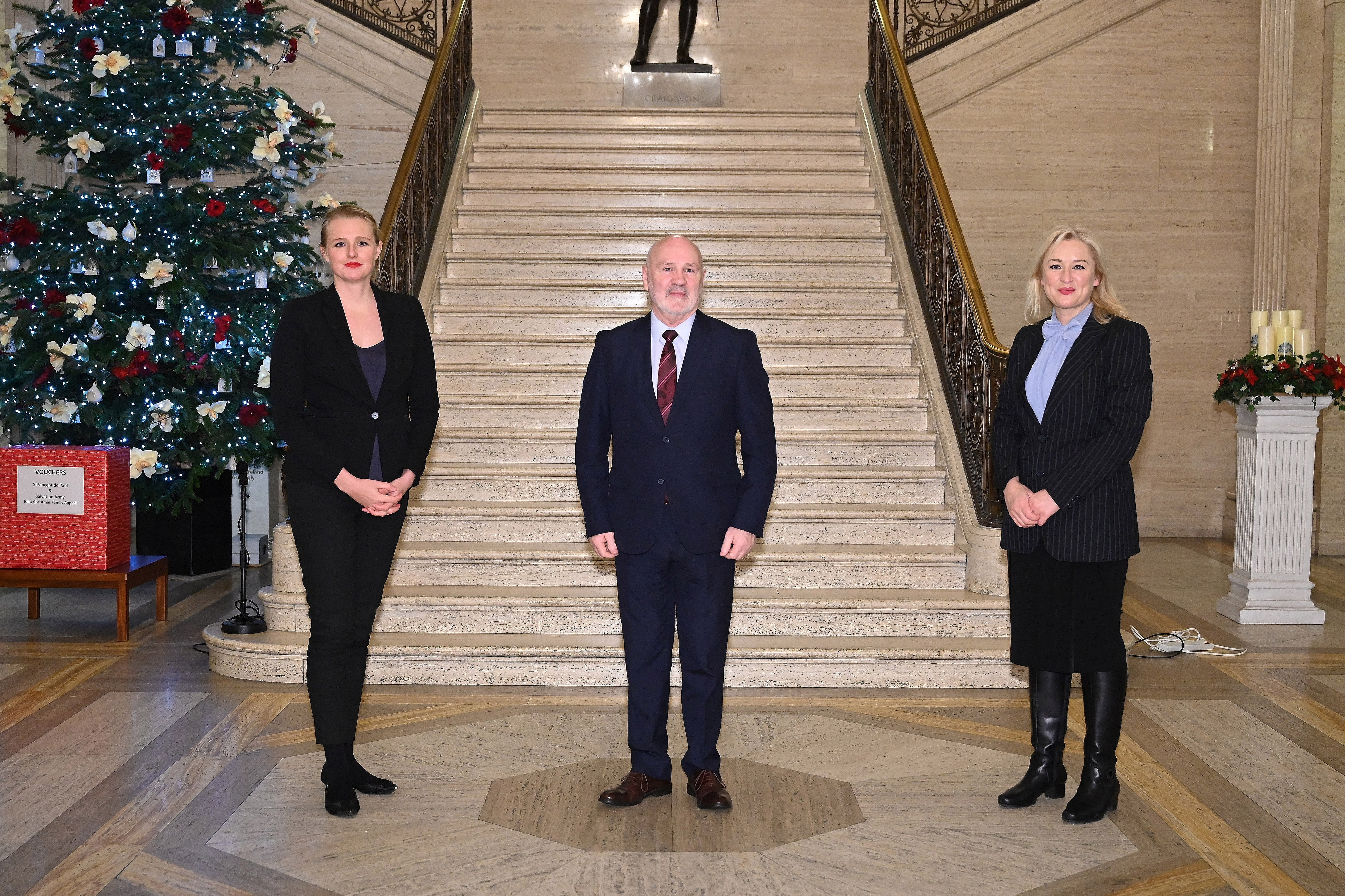 The Speaker of the Northern Ireland Assembly, Alex Maskey MLA pictured with (L-r:  Kristina Laverty (BSL Signer) and Amanda Coogan (ISL Signer).