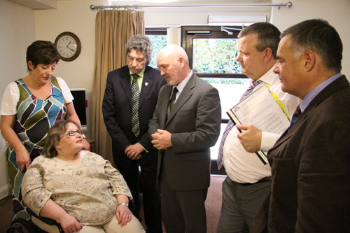 The Northern Ireland Assembly's Committee for Social Development on a visit to Ardkeen, a supported housing project in South Belfast run by the Cedar Foundation. Pictured (l-r) are Debra Stevenson Head of Services at the Cedar Foundation, Ardkeen tenant Fiona Curry, Committee Deputy Chairperson Mickey Brady MLA, Committee Chairperson Alex Maskey, Michael Copeland MLA and Stephen Matthews, Chief Executive of the Cedar Foundation 