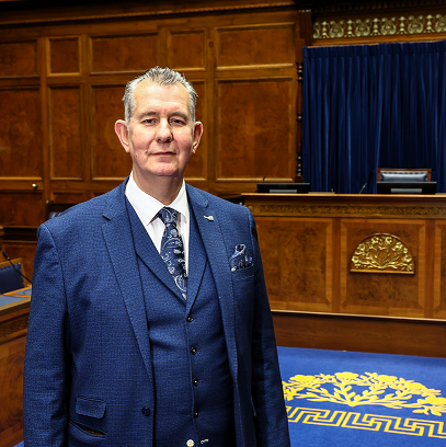 Speaker of the Northern Ireland Assembly, Edwin Poots, pictured standing in the Assembly Chamber in front of the Speaker's table.