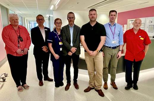 Pictured: Philip McGuigan MLA and Colin McGrath MLA with staff at Ulster Hospital