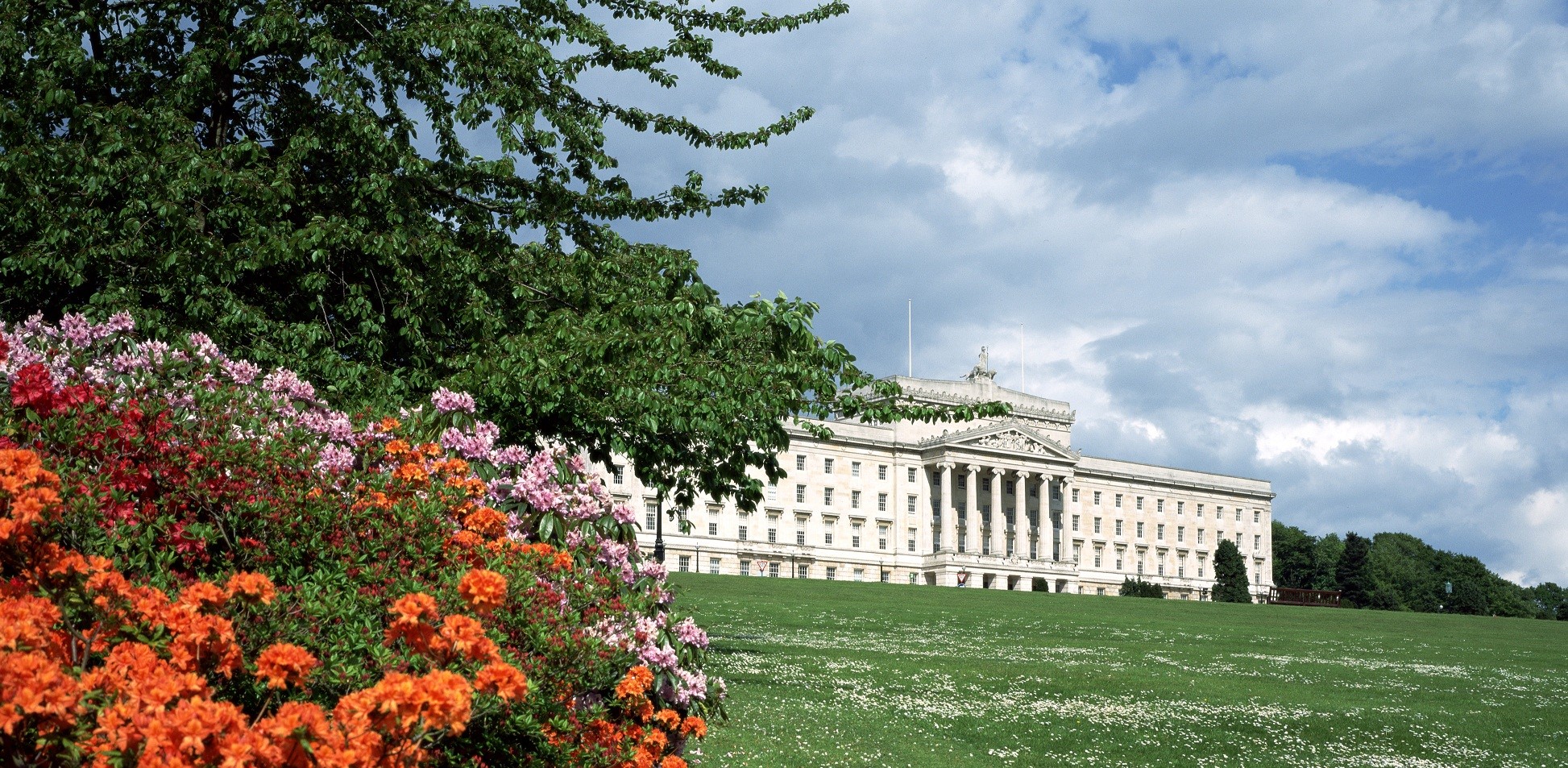 The front of Parliament Buildings on a bright sunny day.