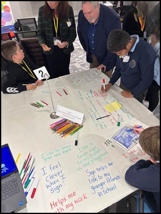 Members of the Committee welcoming members from the deafblind community during an event in October.