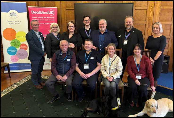 Members of the Committee welcoming members from the deafblind community during an event in October.