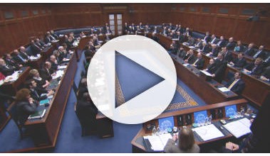 A full Assembly Chamber with a white semi transparent 'Play' button placed in the middle.