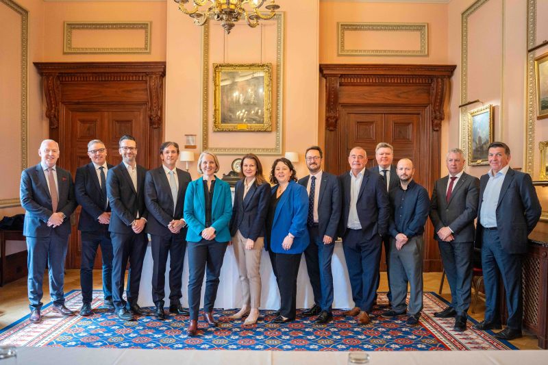image shows the UK Environment Secretary, Emma Reynolds MP pictured with stakeholders in Belfast. The location is not given - but the room is ornate with two heavy oak doors in the background, as well as a portrait on the wall 