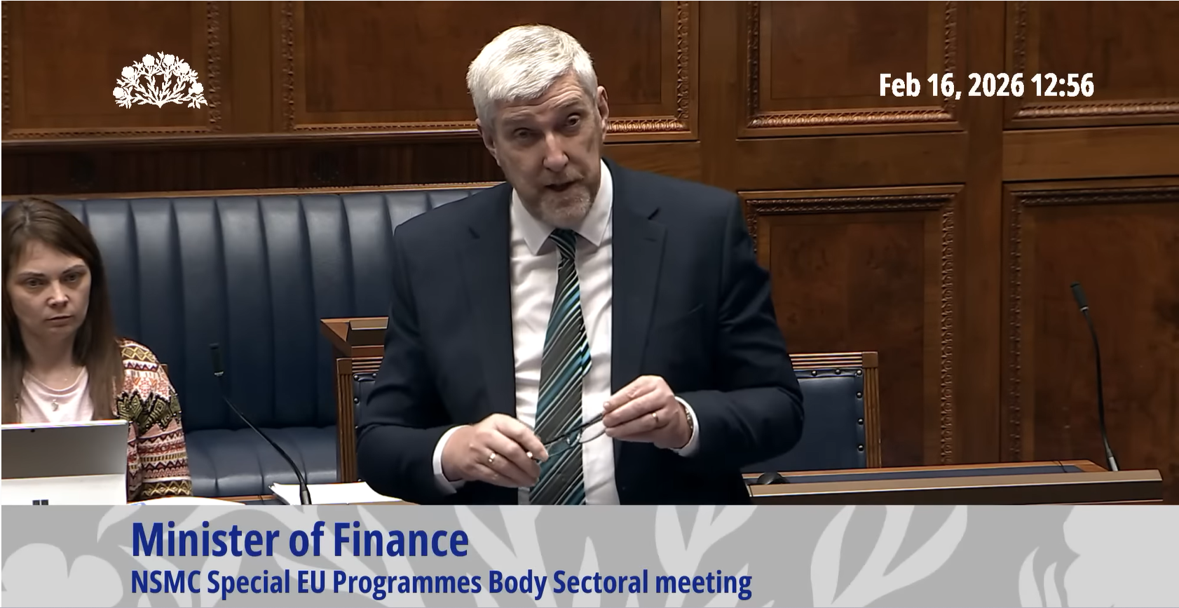 image shows the Assembly's Finance Minister making a statement to the Assembly. 