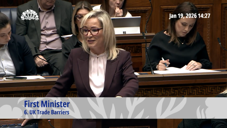 image shows the First Minister in the Assembly Chamber responding to questions from Members during Assembly question time.