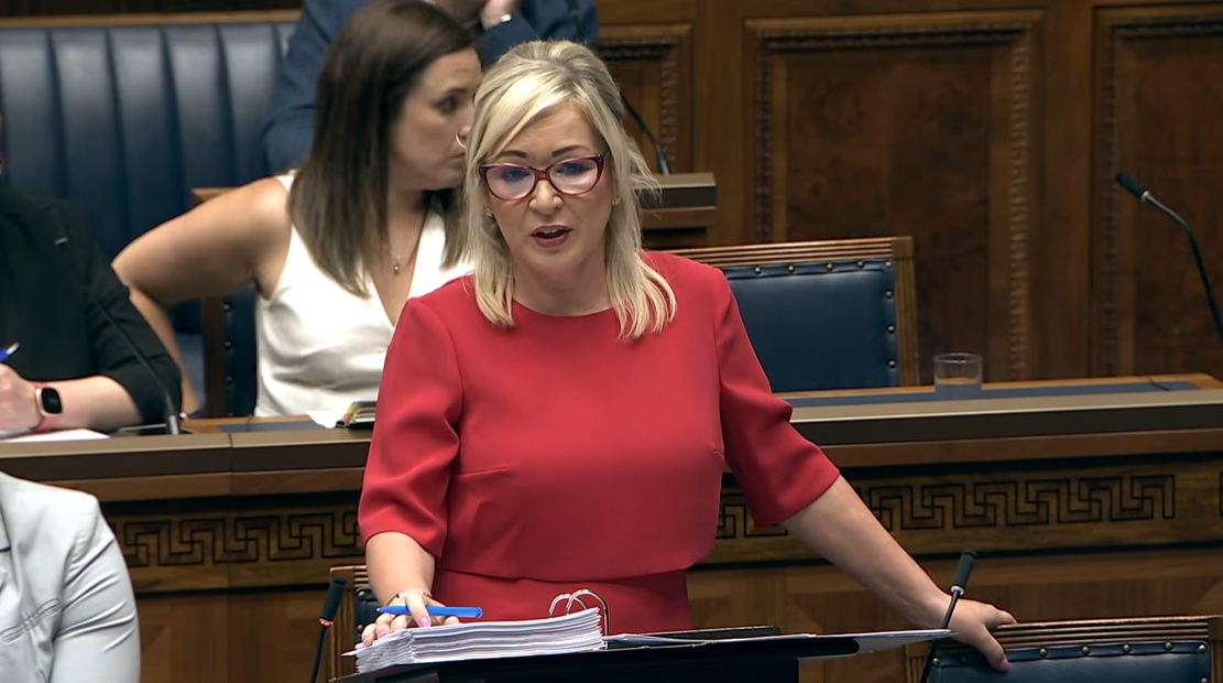 image shows the First Minister in the Assembly Chamber responding to questions from Members during Assembly question time. 