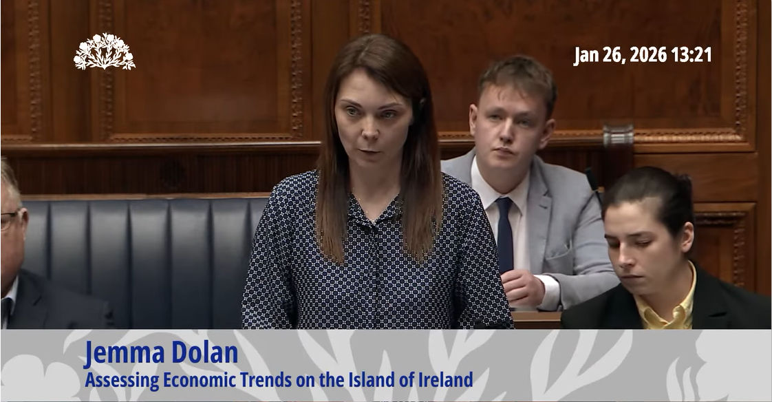 image shows Jemma Dolan MLA giving a speech in the Assembly Chamber