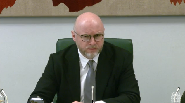 image shows the Chair of the House of Commons Business and Trade Committee sitting in a Committee room   