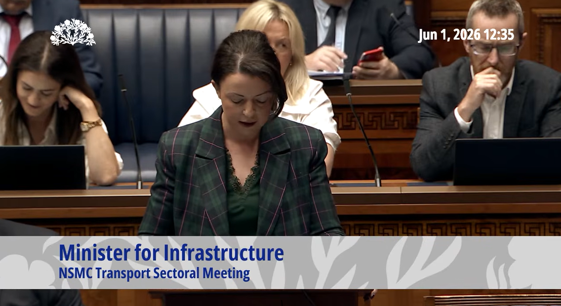 image is of Minister for Infrastructure, Liz Kimmins MLA delivering a statement on the North/South Ministerial Council (NSMC) transport meeting in the Assembly Chamber
