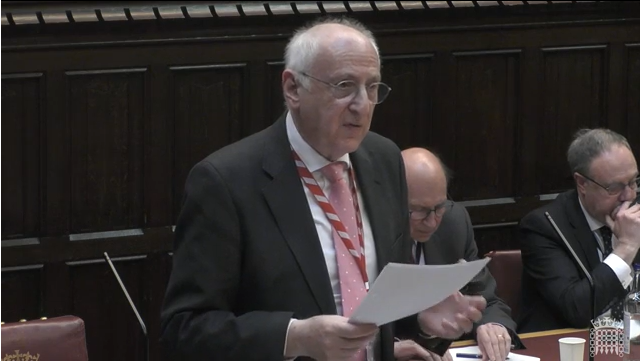 image shows Lord Carlile speaking during a debate in the House of Lords 
