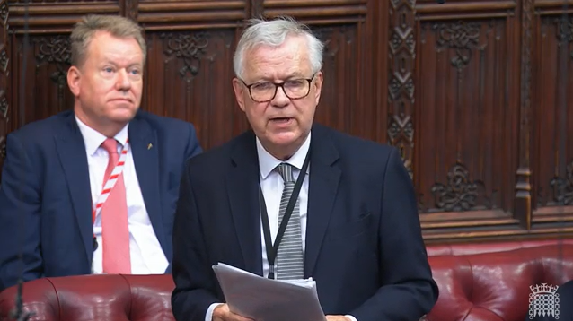 image shows Lord Newby making a speech in the House of Lords Chamber