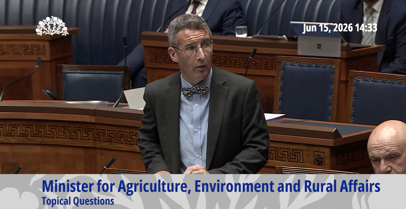 image is the  Minister of Agriculture, Environment and Rural Affairs, Andrew Muir MLA pictured in the Assembly chamber responding to questions during Question Time. 