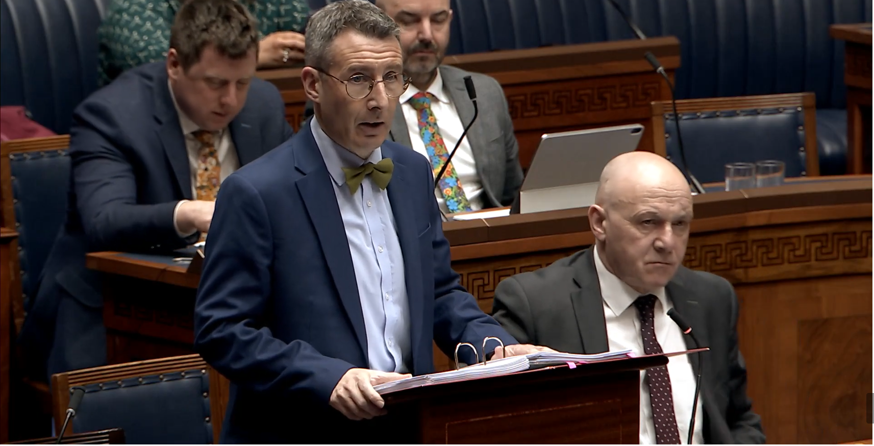 image shows the DAERA Minister responding to Members questions in the Assembly Chamber. 