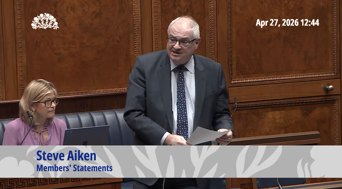 image shows Dr. Steve Aiken MLA in the Assembly Chamber making a statement. 