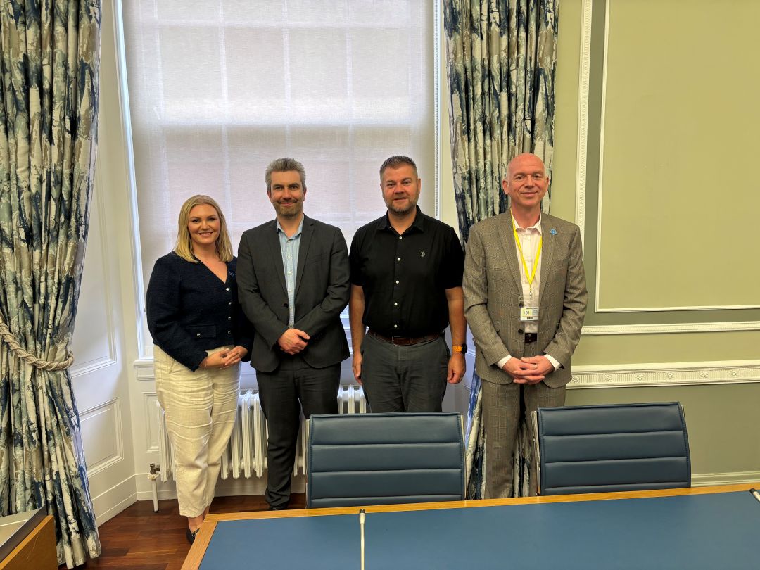 Standing in the Committee meeting room are representatives from Alzheimer's Society with Members of the Committee for Health