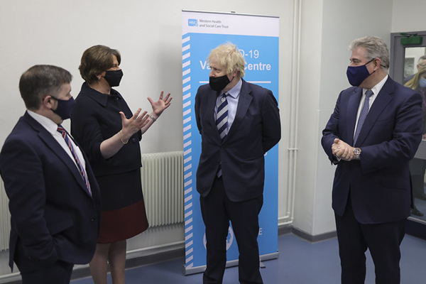 Boris Johnson at a Covid-19 vaccination centre on his visit to Northern Ireland, pictured with First Minister Arlene Foster, Health Minister Robin Swann, and Secretary of State for NI Brandon Lewis. | Source: Andrew Parsons / No 10 Downing Street