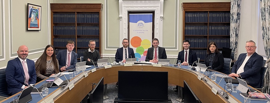 The Economy Committee pictured around the meeting table in room 30 shortly before the start of a meeting. From left to right, David Honeyford MLA, Sorcha Eastwood MLA, Pádraig Delargy MLA, Philip McGuigan MLA, Gary Middleton MLA (the deputy Chairperson), Philip Brett MLA (the Chairperson), Jonathan Buckley MLA, Sinead McLaughlin MLA and Mike Nesbitt MLA.