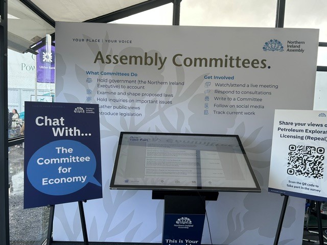 Image showing set up for Committee engagement at Balmoral Show including poster board and interactive screen