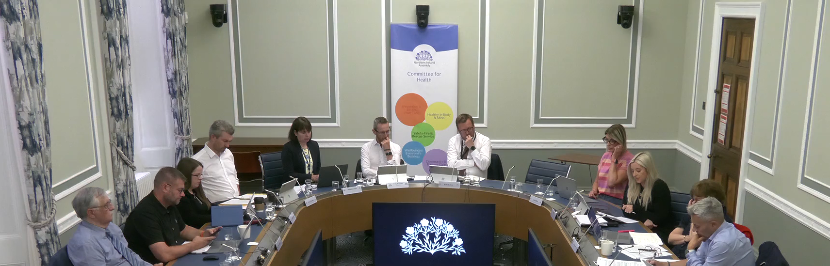 Committee for Health seated round a table in room 29 in Parliament Buildings