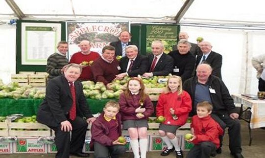 Members and schoolchildren celebrating the Bramley apple
