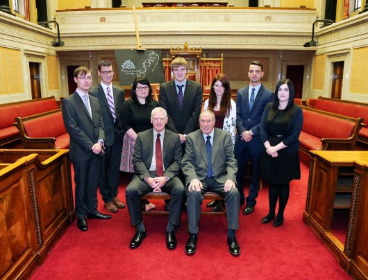 Back Row: L-R Christopher Eisenstadt (Bangor), James Hurley (Fulbright Scholar New York), Jayne McGlaughlin (Antrim), Peadar Ó Lamhna (Monaghan), Dione Todd (Omagh), Daniel Donnelly (Belfast), Anna McDaid (Belfast) Front row: L-R Mr Trevor Reaney Clerk/Chief Executive, Principal Deputy Speaker Mr Mitchel McLaughlin MLA