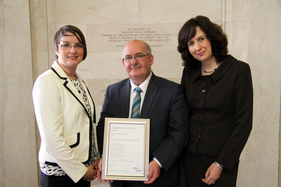 The Speaker of the Northern Ireland Assembly, William Hay MLA is presented with the RNID Action on Hearing Loss ‘Louder than Words’ best practice chartermark.